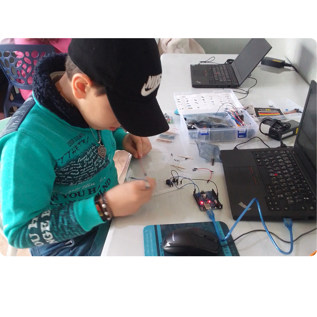 Young learner building an Arduino electronics project